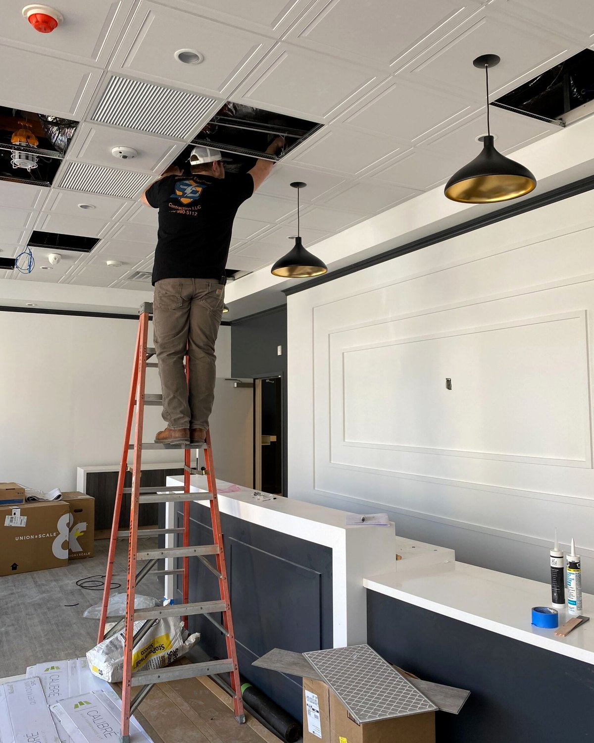 Electrician performing field installation work